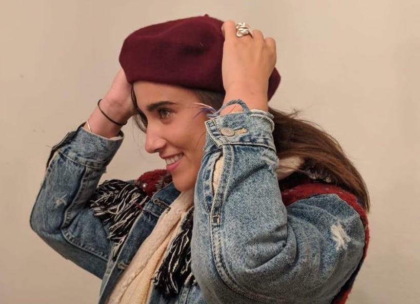 Laura wearing a nice red hat